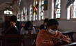 People during th Christmas Mass, in Kolkata, India, on December 25, 2020 amid the Covid-19...