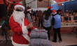 A volunteer from the Community of Sant'Egidio in Mexico,
characterized as Santa Claus to...