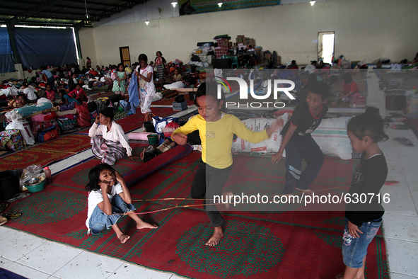 An image available on June 8, 2015 Karo girl playing in temporary shelters after they were evacuated from the memorial raised to the highest...
