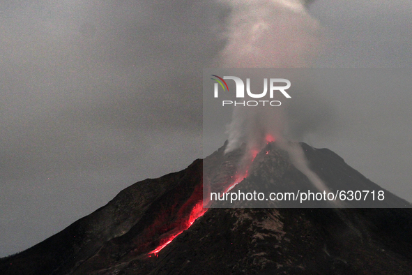 An image available on June 8, 2015 with a long exposure, which shows the Sinabung volcano constantly launching and lava spews volcanic smoke...