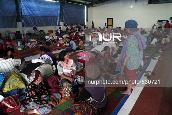 An image available on June 8, 2015, Villagers rest in temporary shelters after they were evacuated from the memorial raised to the highest l...