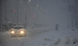 People walk amid heavy snowfall as snowfall contimues for third day in Srinagar, Indian Ad...