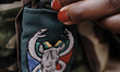 Cute prepares her uniform before a foot patrol in the Balule reserve, near Hœdspruit on No...