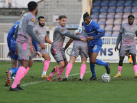 Michael Phillips of Wealdstone works the ball clear from Hartlepool United's Tyler Magloire during the Vanarama National League match betwee...
