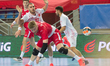 Ozgur Sarak of Turkey and Maciej Gebala of Poland in action during EHF European Men's Hand...