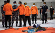 Debris and cloth from passenger at the harbour. Cooperative rescue from Indonesia Millitar...