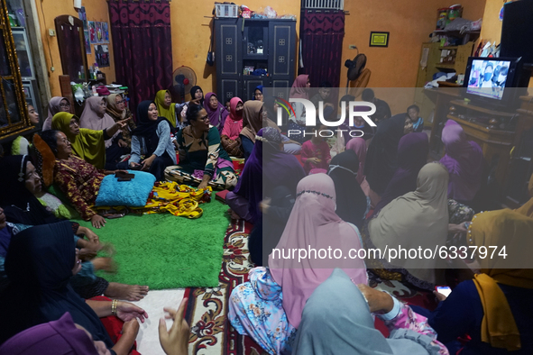 Yusrilanita, the mother of Indah Halima Putri, a victim of the Sriwijaya Air airline SJ 182 crash to Jakarta-Pontianak at her residence, is...