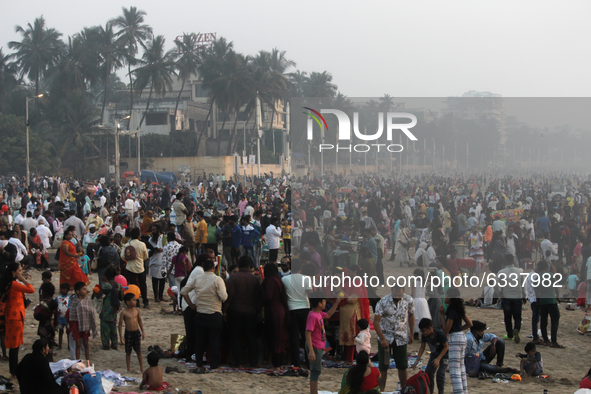 People crowd the beach in Mumbai, India on January 10, 2021. 
