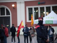 Police are seen protecting the information tent of the Vox political party.
Close to the elections of the Generalitat of Catalonia, the Span...