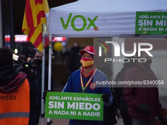 Man with protection mask of the Spanish flag is seen with a sign that says, forward Spaniards without means to anything or anyone.
Close to...