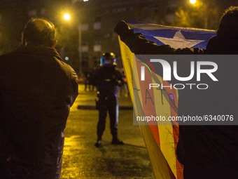 Protester is seen showing Catalan independence flag to police.
Close to the elections of the Generalitat of Catalonia, the Spanish extreme r...