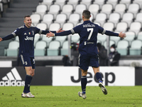 Cristiano Ronaldo of Juventus FC celebrates after scoring a goal with Federico Bernardeschi during the Serie A football match between Juvent...
