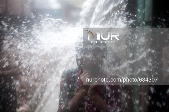 Children during pre monsoon rains in Dhaka, Bangladesh, on June 11, 2015. In last 24 hour more than 100 milimeter rain recorded in different...