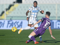 Ashley Young of FC Internazionale and Gaetano Castrovilli of ACF Fiorentina compete for the ball during the Coppa Italia match between ACF F...