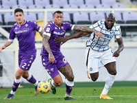 Igor of ACF Fiorentina and Romelu Lukaku of FC Internazionale compete for the ball during the Coppa Italia match between ACF Fiorentina and...