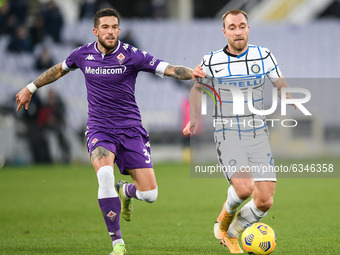 Christian Eriksen of FC Internazionale and Cristiano Biraghi of ACF Fiorentina compete for the ball during the Coppa Italia match between AC...