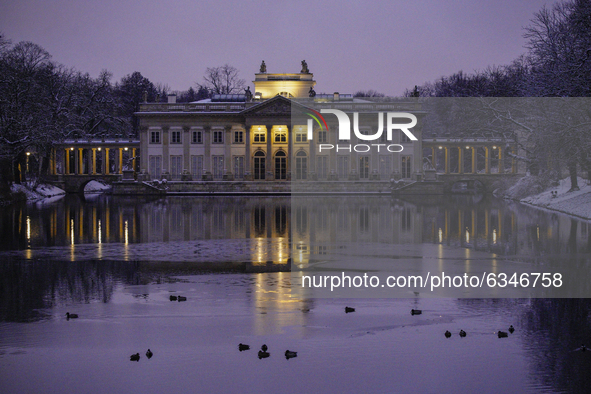 The Palace on the Isle is seen in the Royal Baths park in Warsaw, Poland on January 13, 2021. Though temperatures normally reach below zero...