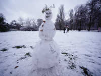A snowman is seen in the Royal Baths park in Warsaw, Poland on January 13, 2021. Though temperatures normally reach below zero in January in...