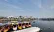 Shikaras remain stranded in frozen Dal Lake, Srinagar, Indian Administered Kashmir on 14 J...