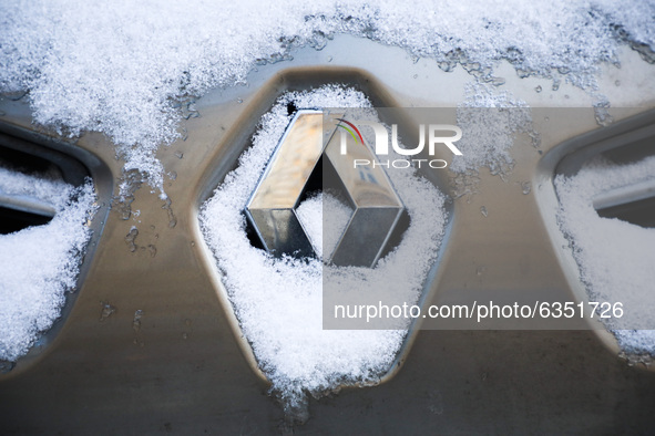Renault car emblem is covered with snow in Krakow, Poland. January 15, 2021. 