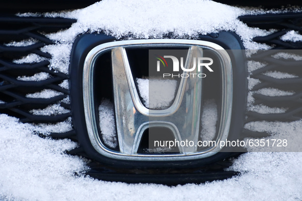 Honda car emblem is covered with snow in Krakow, Poland. January 15, 2021. 