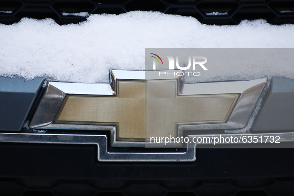 Chevrolet car emblem is covered with snow in Krakow, Poland. January 15, 2021. 