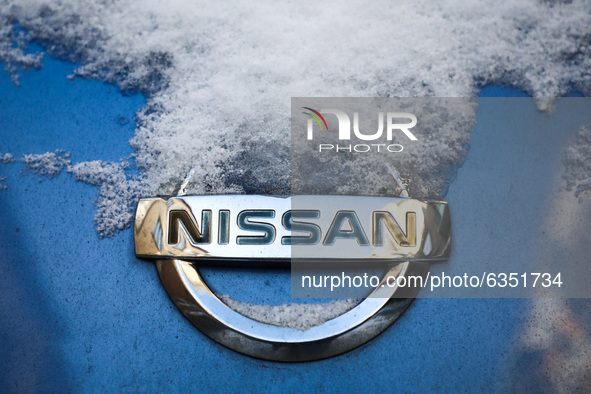 Nissan car emblem is covered with snow in Krakow, Poland. January 15, 2021. 