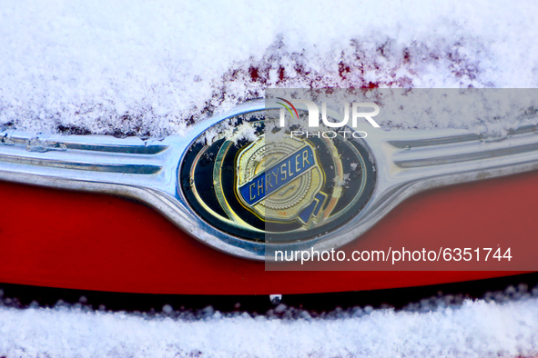 Chrysler car emblem is covered with snow in Krakow, Poland. January 15, 2021. 