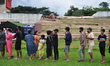 A number of earthquake survivors queued for distribution of food aid at the Manakarra Stad...