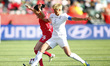 EDMONTON, June 12, 2015 () -- Canada's Jonelle Filigno (L) vies with New Zealand's Abby Er...