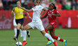 (150612) -- EDMONTON, June 12, 2015 () -- Hannah Wilkinson of New Zealand(L) vies during t...