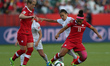 (150612) -- EDMONTON, June 12, 2015 () -- Desiree Scott (R)of Canada vies during the Group...