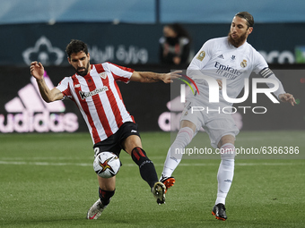 Sergio Ramos of Real Madrid and Raul Garcia of Athletic  compete for the ball during the Supercopa de Espana Semi Final match between Real M...