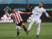 Sergio Ramos of Real Madrid and Raul Garcia of Athletic  compete for the ball during the Supercopa de Espana Semi Final match between Real M...