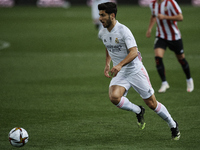 Marco Asensio of Real Madrid runs with the ball during the Supercopa de Espana Semi Final match between Real Madrid and Athletic Club at Est...