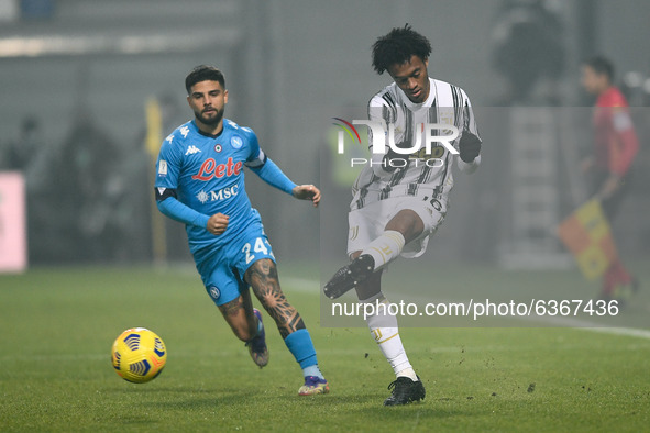 Juan Cuadrado of Juventus FC and Lorenzo Insigne of SSC Napoli compete for the ball during the Italian PS5 Supercup Final match between FC J...