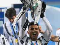 Danilo of Juventus FC celebrates after winning the Italian Super Cup Final match between FC Juventus and SSC Napoli at the Mapei Stadium - C...
