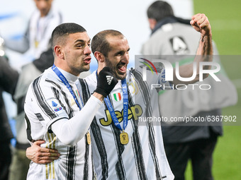 Merih Demiral of Juventus FC and Giorgio Chiellini of Juventus FC celebrate after winning the Italian Super Cup Final match between FC Juven...