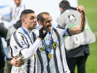 Merih Demiral of Juventus FC and Giorgio Chiellini of Juventus FC celebrate after winning the Italian Super Cup Final match between FC Juven...