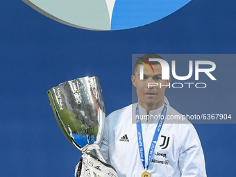 Cristiano Ronaldo of Juventus FC celebrates with the trophy after winning the Italian Super Cup Final match between FC Juventus and SSC Napo...