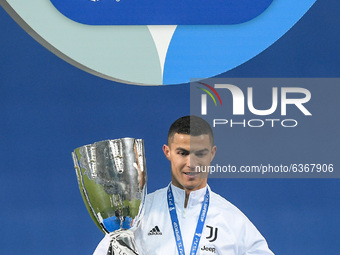 Cristiano Ronaldo of Juventus FC celebrates with the trophy after winning the Italian Super Cup Final match between FC Juventus and SSC Napo...