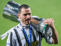 Leonardo Bonucci of Juventus FC celebrates with the trophy after winning the Italian Super Cup Final match between FC Juventus and SSC Napol...