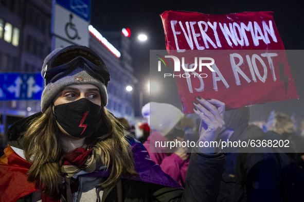 People take part in a demonstration against the abortion ban law, in Warsaw, Poland, on January 20, 2021. 