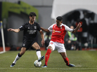 João Ferreira disputes the ball with Galeno during the Allianz Cup semi final game between SL Benfica and Braga, at  Estádio Municipal de Le...