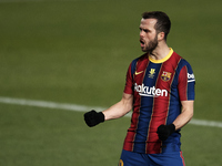 Miralem Pjanic of Barcelona celebrates after scoring his sides first goal during the Supercopa de Espana Semi Final match between Real Socie...