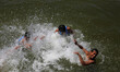 Palestinians enjoy themselves at the beach in the Mediterranean Sea in Gaza City, June 15,...