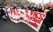 French students demonstrate behind a banner on Place de la Liberté on February 4, 2021, in...