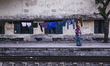 a women standing infront of an old building  on June 15, 2015 in Dhaka, Bangladesh.
