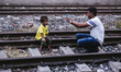 a father taking a picture of his son with his mobile phone  on June 15, 2015 in Dhaka, Ban...