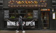 A banner 'Wine Shop Open' seen outside of Brookwood steak and seafood restaurant on Baggot...